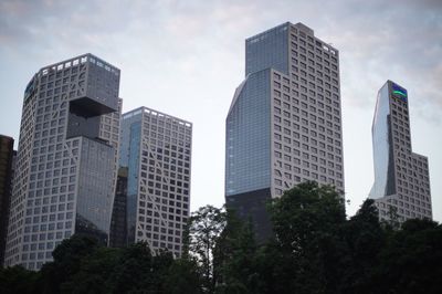 Low angle view of modern buildings against sky