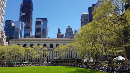 View of modern buildings against blue sky