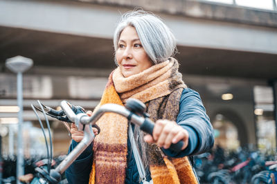 Mature woman with bicycle