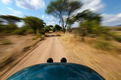 Blurred motion of car on road
