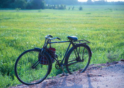 Bicycle parked on field