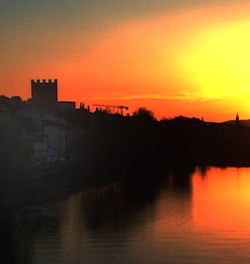 Scenic view of river at sunset