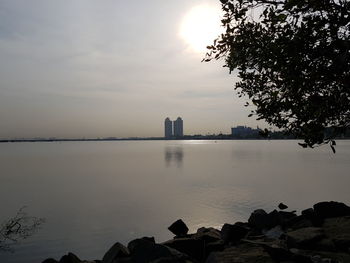 Scenic view of lake against sky during sunset