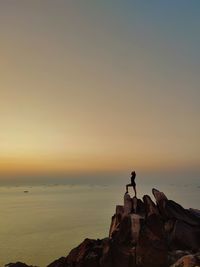 Scenic view of sea against clear sky during sunset