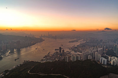 High angle view of buildings against sky during sunset