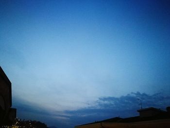 Low angle view of house against blue sky