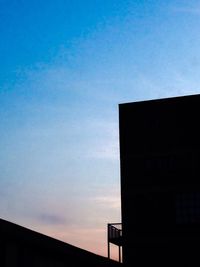 Low angle view of building against blue sky