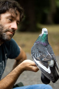 Man holding pigeon