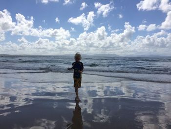 Scenic view of sea against cloudy sky