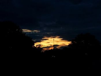 Low angle view of silhouette trees against sky during sunset