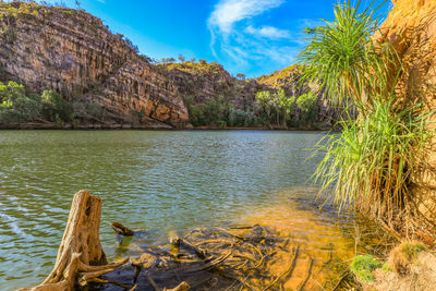 Scenic view of lake and mountains against sky