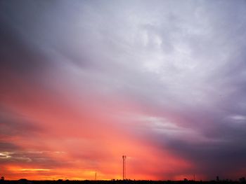 Low angle view of silhouette dramatic sky during sunset