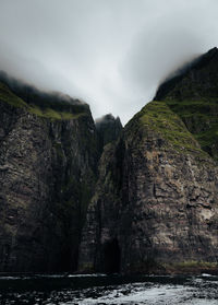 Scenic view of waterfall against sky