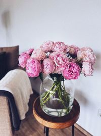 Close-up of pink flower vase on table