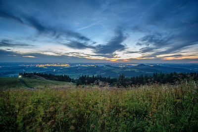 Scenic view of field against sky during sunset