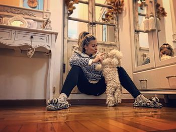 Woman with dog at home