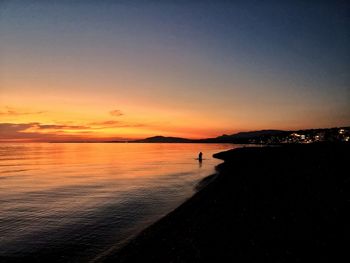 Scenic view of beach against sky during sunset