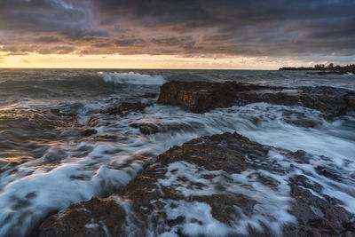 Scenic view of sea against sky during sunset