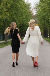 Rear view of women walking in park