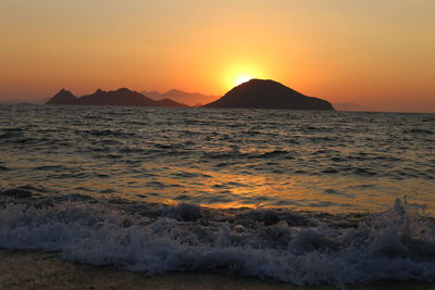 Scenic view of sea against sky during sunset