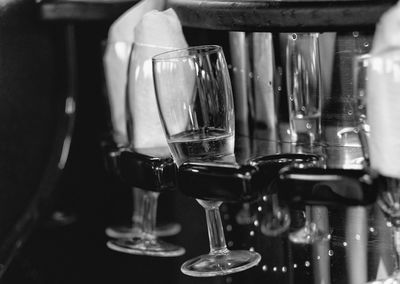 Close-up of wine glasses on table