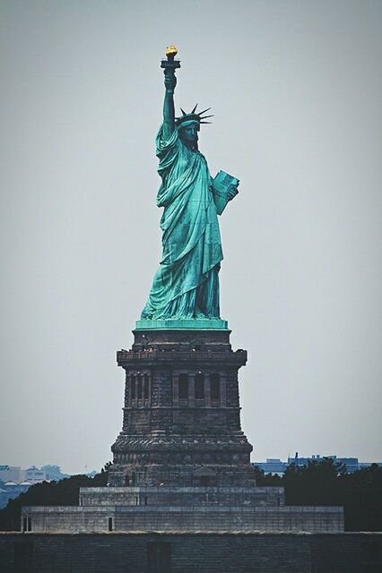 statue, human representation, sculpture, art and craft, art, creativity, clear sky, low angle view, famous place, travel destinations, international landmark, tourism, travel, statue of liberty, architecture, capital cities, built structure, copy space