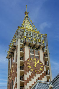 Clock tower in batumi against blue sky, city of georgia
