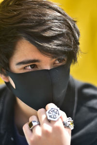 Close-up portrait of young woman with eyes closed