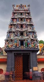 Low angle view of temple against building