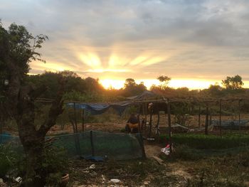 Scenic view of field against sky during sunset