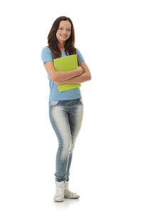 Portrait of a smiling young woman against white background