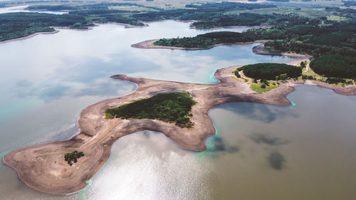 High angle view of lake and trees against sky