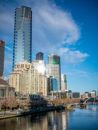 Modern buildings in city against sky