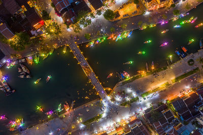 High angle view of illuminated buildings in city at night