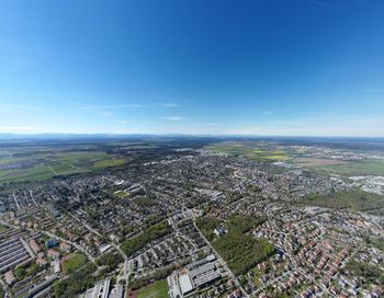 Aerial view of townscape against sky