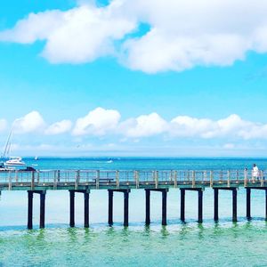 Pier over sea against sky