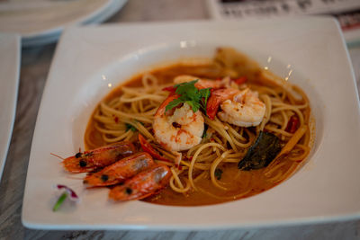 High angle view of noodles in plate on table