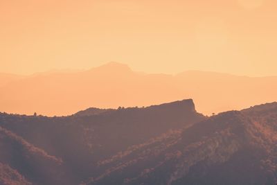 Scenic view of mountains against sky during sunset