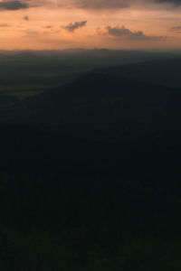 Scenic view of silhouette landscape against sky during sunset