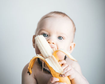 Cute kid eating banana