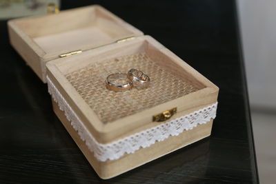 High angle view of wedding rings on table