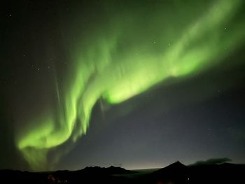 Scenic view of mountains against sky at night