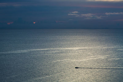 Scenic view of sea against sky at sunset