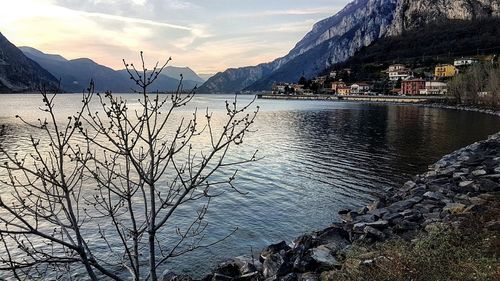 Scenic view of lake against cloudy sky
