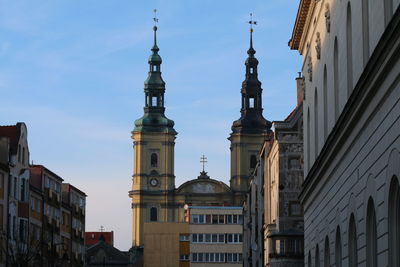 Low angle view of buildings in city against sky