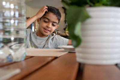 Boy studying at table