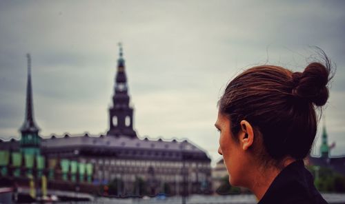 Close-up of woman looking at church