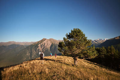 Rear view of man walking on mountain 