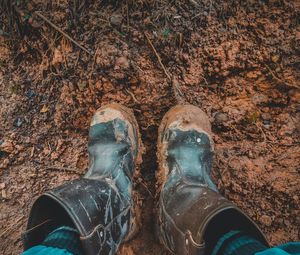 South sumatera, indonesia - january 28, 2020, dirty safety shoes exposed to mud on january 28, 2020