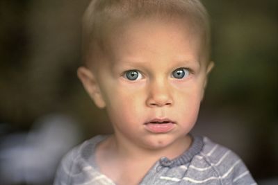 Close-up portrait of cute baby boy at home